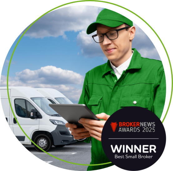 Man with tablet in front of vans