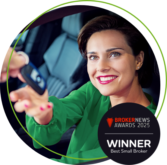 Woman being handed car keys whilst sitting in a car
